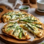 asparagus flatbread with crispy crust and melted cheese